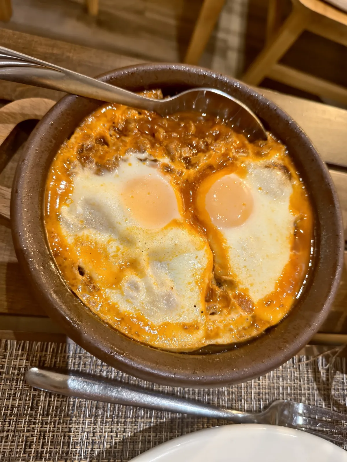 Kima with eggs baked in a clay dish