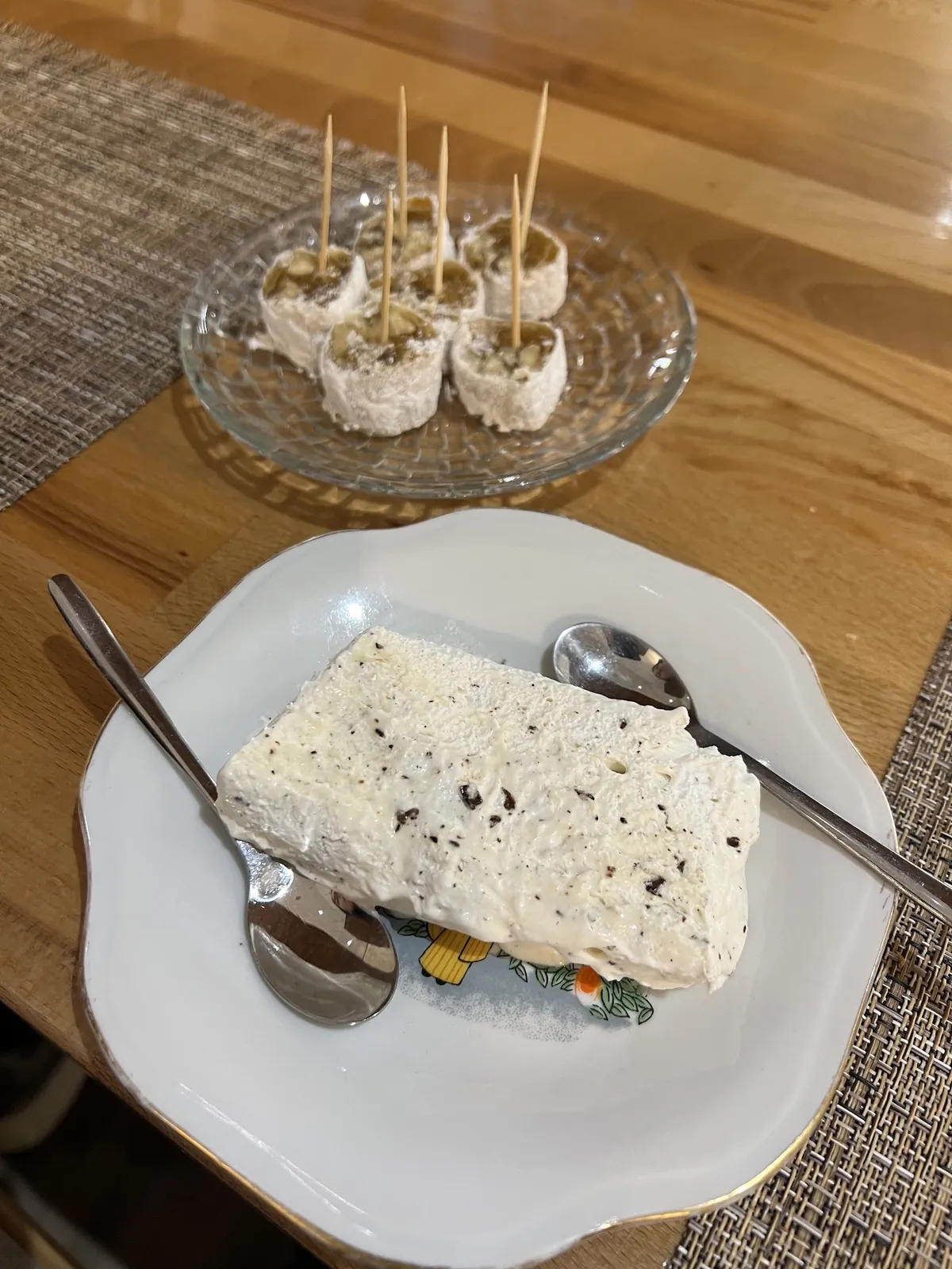 Local desserts on a plate and on wooden sticks